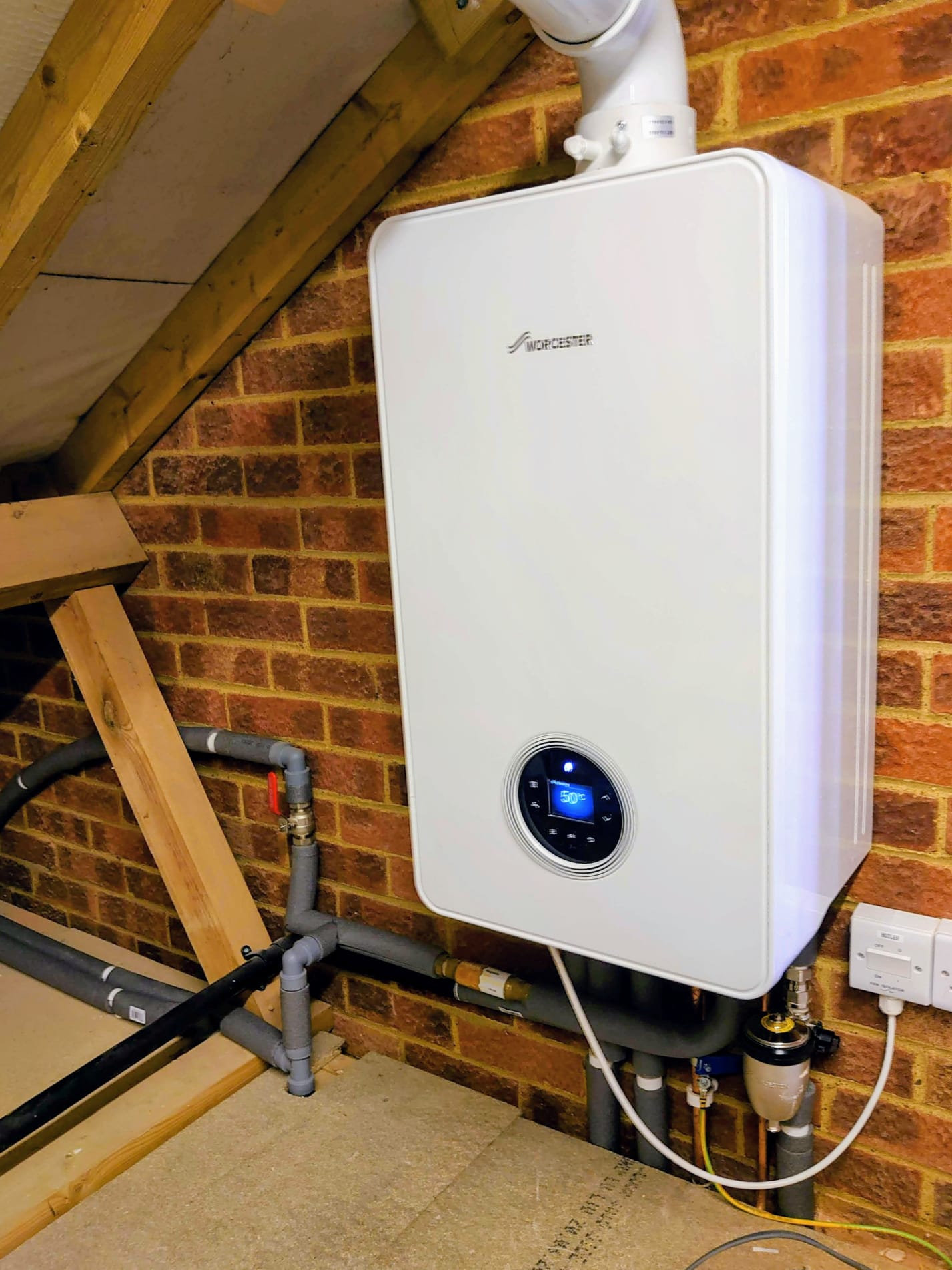 Worcester boiler installed on brick wall
